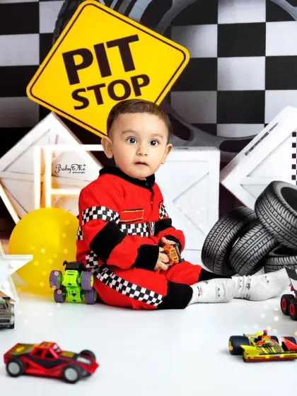 A quiet moment at the pit stop. Even in a high-energy theme like this, I make sure to capture those sweet, calm portraits of your little one.