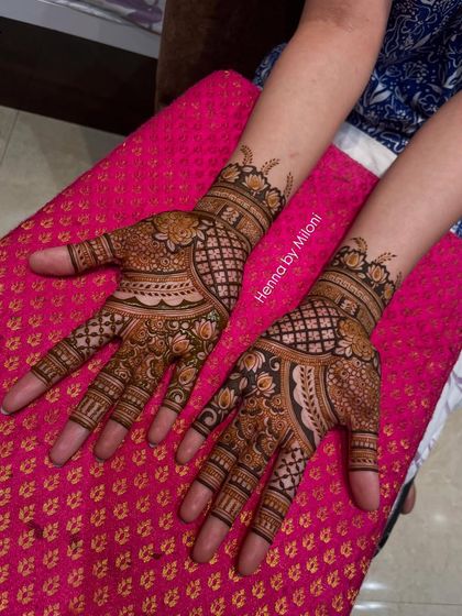 A beautiful design featuring a mix of grids, florals, and a central peacock motif.