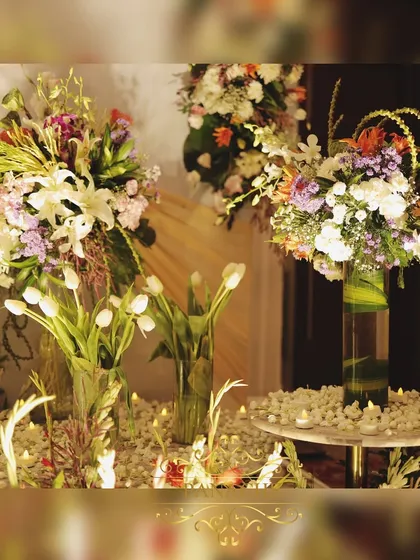 A beautiful arrangement of flowers, including white tulips, set on a side table to enhance the decor.