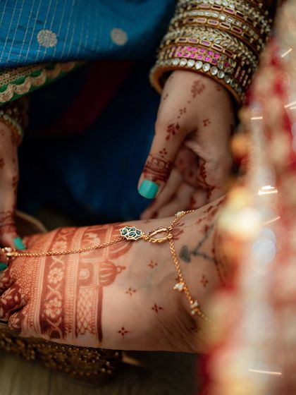 A close-up of the rich stain on the bride's feet, adorned with a beautiful payal. The deep color is the result of my high-quality, natural henna.