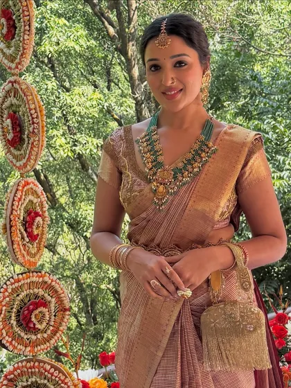 A beautiful shot of the bride in her traditional silk saree. My draping ensures the pleats are perfect and the pallu falls gracefully.