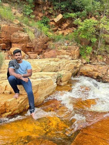 Taking a moment to relax by the flowing water.