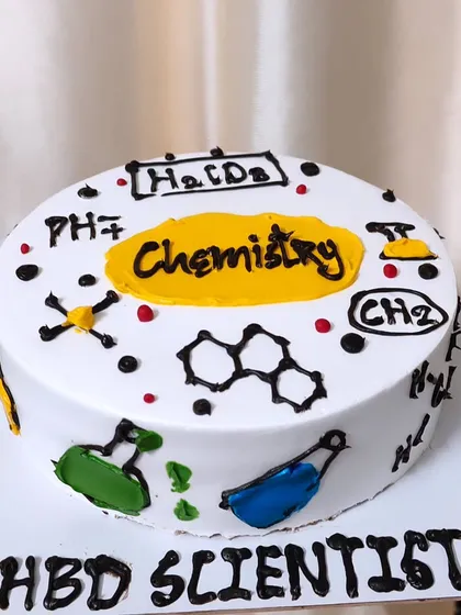 For the scientist in your life! This chemistry-themed cake is decorated with beakers, formulas, and molecules.