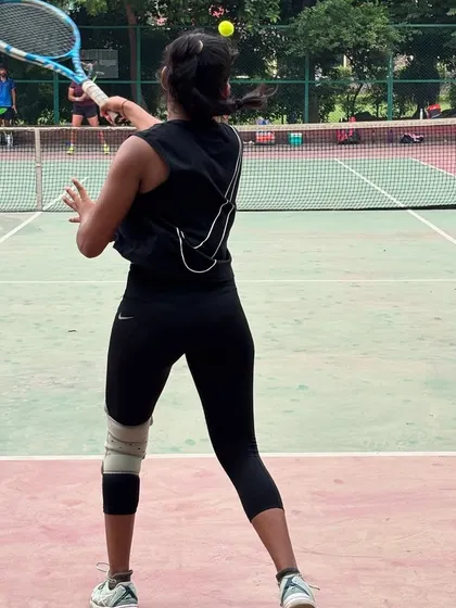 A player wearing a knee brace continues to train hard, demonstrating the resilience and dedication that defines our community.