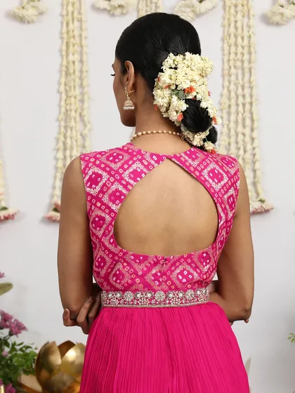 The back of the pink Bandhani dress also features a keyhole design, adding a touch of contemporary flair.