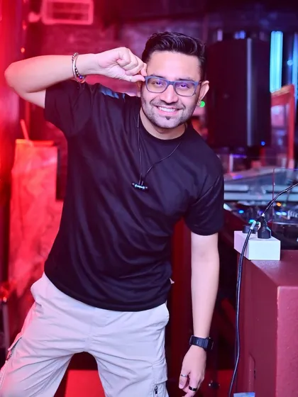 Having some fun behind the decks during a packed night.
