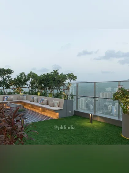 As evening approaches, this rooftop garden becomes an even more magical space. Integrated lighting in the planters and under the seating creates a warm, inviting atmosphere, perfect for enjoying the city views at night.