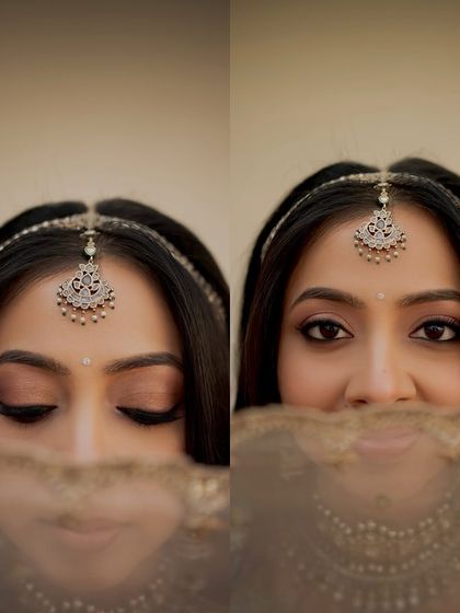 A playful peek-a-boo through the veil. This close-up shows the soft winged liner and shimmery eyeshadow that define her eyes.