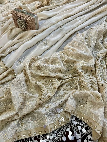 Another draped view, highlighting the texture and shimmer of the embellished fabric.