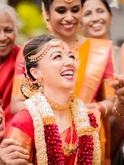 The pure joy of a wedding is in moments like these. This candid shot captures the bride sharing a heartfelt laugh with her family during the ceremony. My goal is to document these unscripted, real emotions that you will cherish forever.