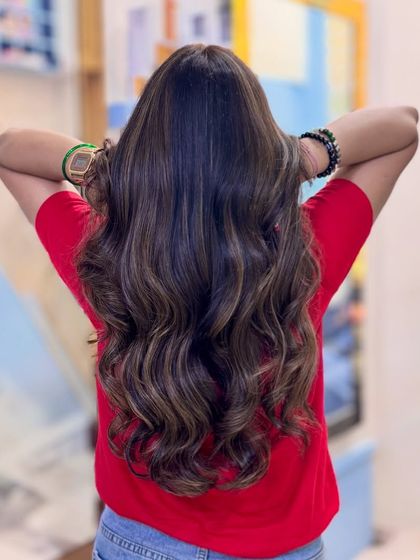 Our Toffee hair color obsession continues. These images display the rich, warm tones and seamless blending of our custom toffee shade on long, wavy hair.