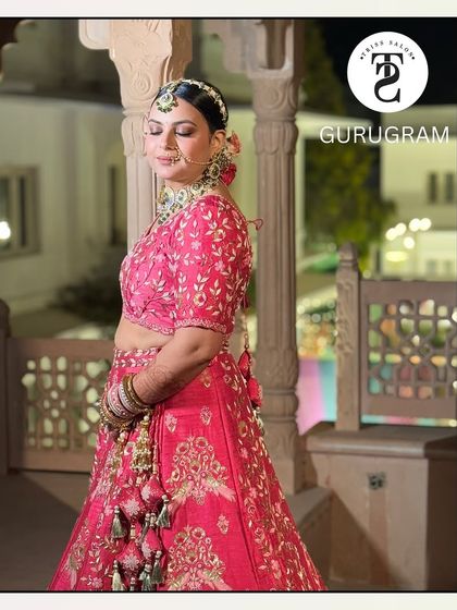 A side profile showcasing the intricate details of the bridal hair and makeup. The clean updo and soft contouring highlight her features beautifully against the palatial backdrop.