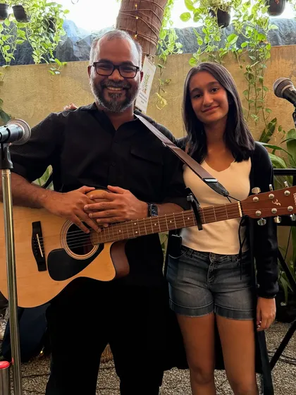 A moment of connection between two performers. Our stage is open to artists of all ages, fostering a love for music across generations.