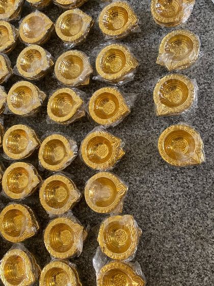 The behind-the-scenes reality of preparing for Diwali. Here are hundreds of golden diyas, ready to be packed into our festive hampers.