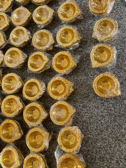 A behind the scenes look at preparing for Diwali orders. A sea of golden diyas, ready to be packed and bring light to many homes.