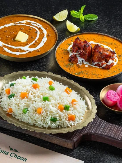 A delicious combo of Dal Makhani, Chicken Tikka Masala, and vegetable rice from Dana Choga.