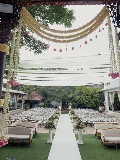 A view down the aisle from the mandap, showing the grand scale of the seating arrangement.
