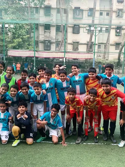 A group photo of our U7, U9, and U11 teams after an exciting practice match with another academy, building camaraderie and experience.