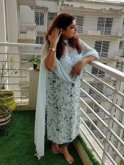 Another shot of our client enjoying her comfortable and stylish custom-made suit.