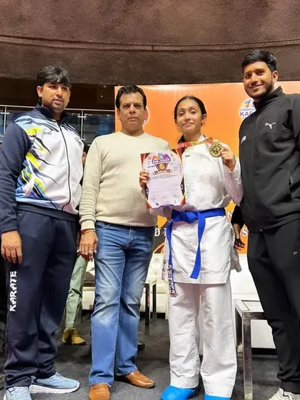 Celebrating Kaira's victory with her family and team captain. A new victory and just the beginning of her journey.