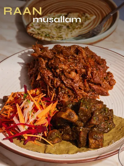 A crowd-pleaser for any event, our Raan Musallam is slow-cooked to perfection. This tender, spice-packed leg of lamb is a centerpiece dish that’s both impressive and incredibly satisfying, served with fresh salad and potatoes.