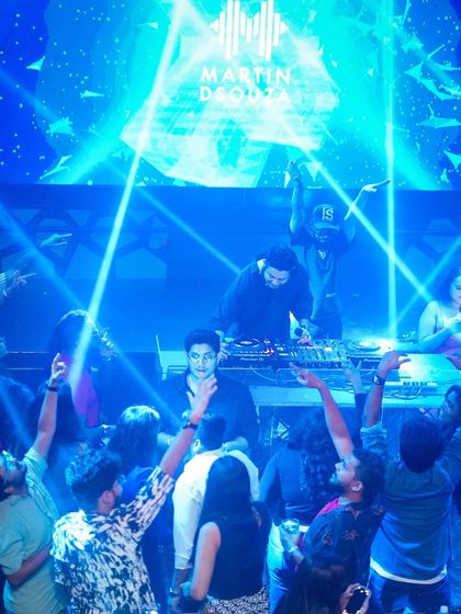 The view from the dance floor, looking up at me on the stage with my logo on the screen.