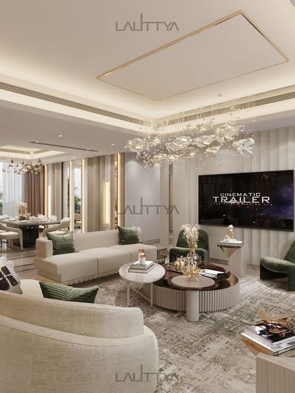A view of the lounge area focusing on the TV wall and seating arrangement. The curved sofas encourage conversation, while the neutral palette is punctuated by deep green accent chairs, creating a balanced and sophisticated environment.