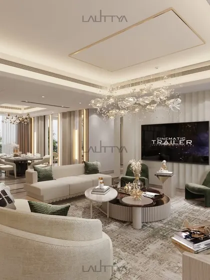 This angle highlights the entertainment focus of the living area, with a large screen set against a refined, neutral backdrop. The curved sofas encourage social gatherings, blending comfort with high-end design.