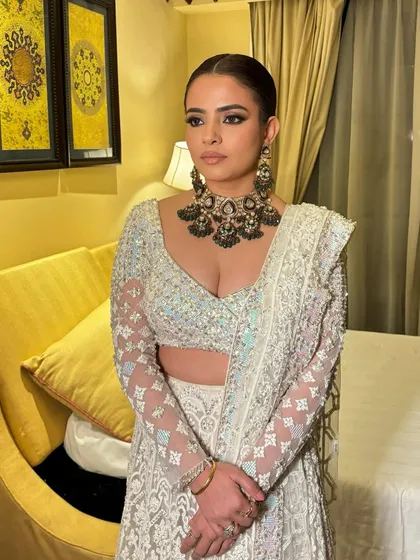 A powerful, confident portrait of Khushboo. The makeup is bold and complements her strong features.