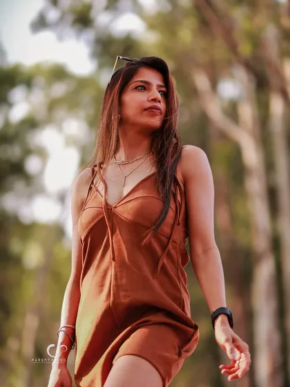 A low-angle shot that makes the subject look powerful and statuesque. The golden light and natural background create a beautiful, earthy palette.