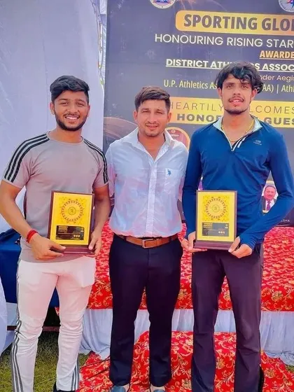 Posing with our decorated athletes. Their success is my success. This is the result of our shared commitment.