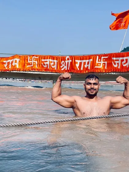 A dip in the holy river with a backdrop of devotion. The energy of these places is immense and adds to my inner strength.