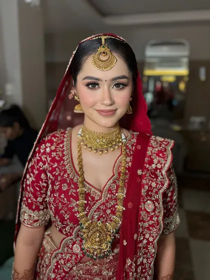 A close-up of this bride's flawless makeup. The skin is radiant, and the eyes are softly defined, creating a look that is both beautiful and comfortable to wear.