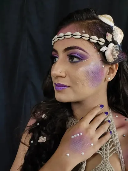 Creating this mermaid fantasy look involved using airbrushing to create a scale effect on the skin, complemented by pearls and shells. This type of detailed character work is something I love doing for creative shoots and fantasy-themed projects.