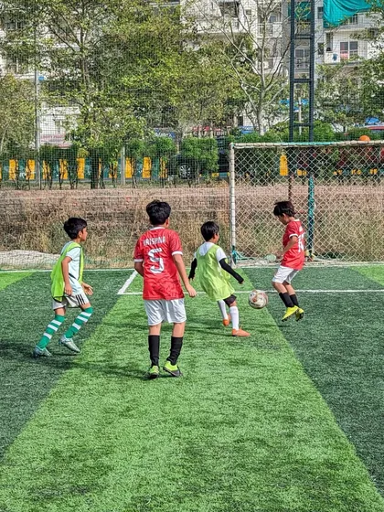 Intense action from a friendly match between our U10 team and Goal Hunters U10. These games are crucial for development and applying skills learned in training.