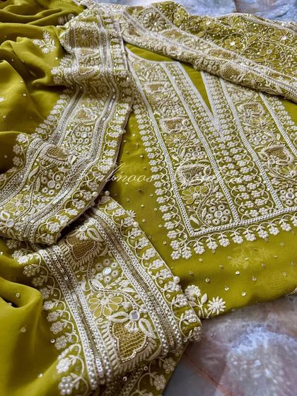 Another flat-lay of the suit, showing the full design of the kurta and dupatta.