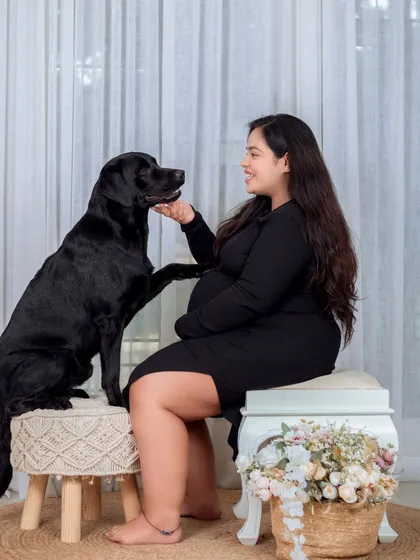 Family includes our beloved pets, and we love welcoming them into our maternity sessions. This portrait captures the sweet, gentle connection between an expecting mother and her loyal dog, who seems to know a new best friend is on the way.