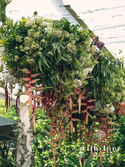 A hanging floral installation from the 'Garden of Gaia' event, adding a touch of drama and beauty.