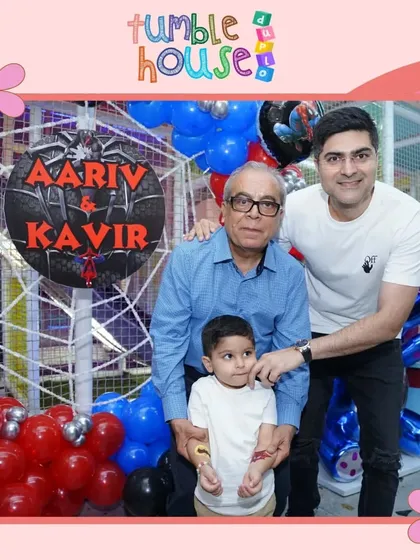 Three generations celebrating together at a Spiderman-themed party. It's a joy to host events for the whole family.