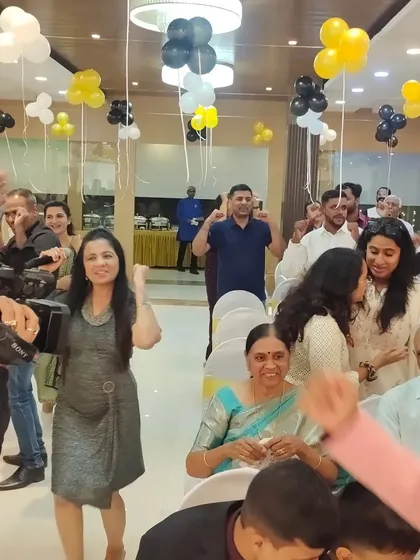 A candid shot of me dancing with the guests at a 50th birthday party. It's all about creating a friendly and energetic atmosphere where everyone feels comfortable celebrating.