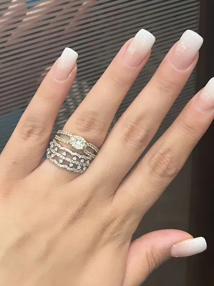 A soft and subtle baby boomer or ombre French manicure on square-shaped nails, blending white tips into a natural pink base.
