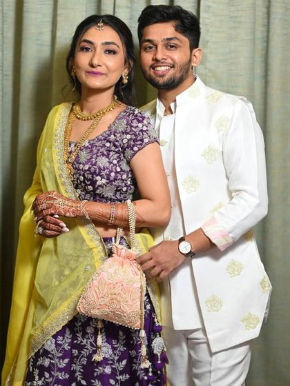 A simple and elegant cream-on-cream kurta jacket set. The jacket has subtle buti embroidery, making it a perfect choice for a Puja or Roka ceremony.