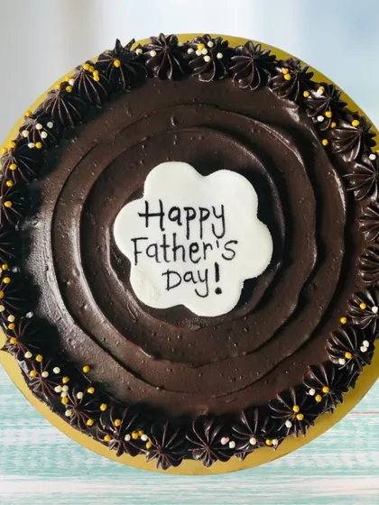 A simple and sweet chocolate cake for Father's Day. The rich chocolate frosting and festive sprinkles make it a classic choice that's sure to make any dad feel loved and celebrated.