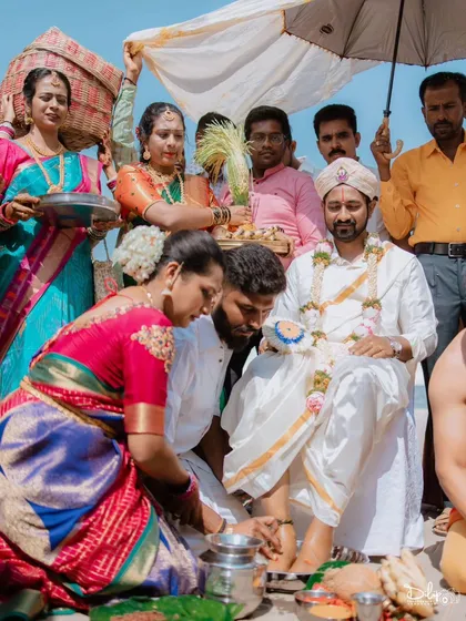 The sacred ritual of washing the groom's feet. I respectfully capture these important traditions that are central to the wedding ceremony.