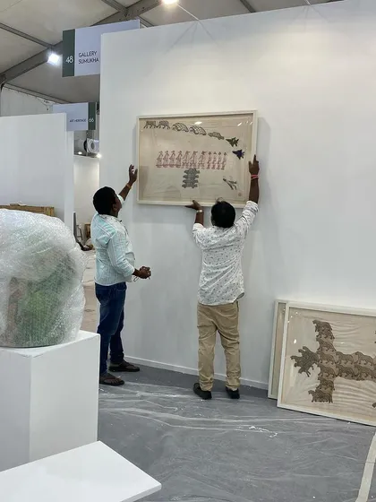 My team installing Archana Hande's large embroidered works for our booth at Art Mumbai. Setting up for an art fair is an intense, coordinated effort.