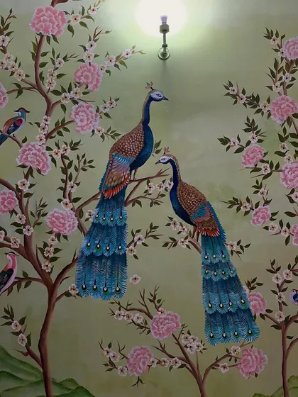 This elegant peacock wall mural is all about the details. I painted two peacocks perched on cherry blossom branches for a soft and sophisticated look.