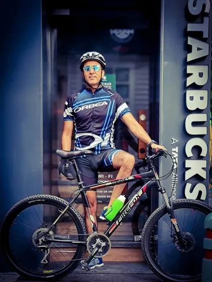 Our captain posing in front of a Starbucks. A coffee stop is a welcome break during a long ride.