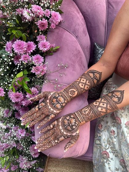 A beautiful design with lotus mandalas and geometric patterns, set against a backdrop of purple flowers.