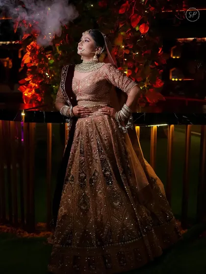 A magical bridal entry. The way the light catches her pastel lehenga is just breathtaking.