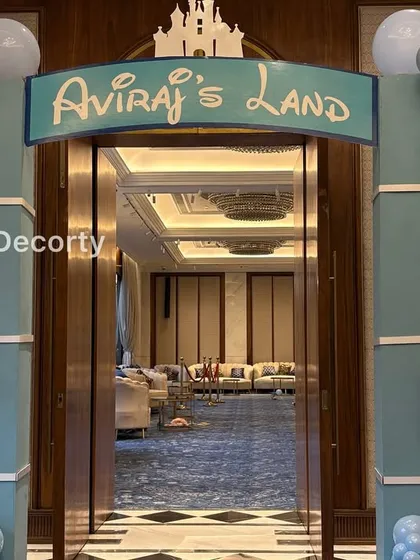 A detailed shot of the "Aviraj's Land" entrance sign and the intricate balloon work framing the doorway.